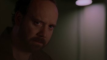 Movie still from “Lady in the Water” (2006), directed by M. Night Shyamalan – A person looking at the camera; Close Up shot, Over the shoulder angle