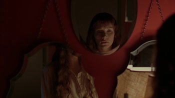 Movie still from “Lady in the Water” (2006), directed by M. Night Shyamalan – A woman standing in front of a mirror; Close Up shot, Over the shoulder angle