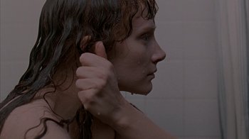 Movie still from “Lady in the Water” (2006), directed by M. Night Shyamalan – A young woman is taking a shower in a bathroom; Extreme Close Up shot, Overhead angle