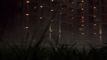 Movie still from “Lady in the Water” (2006), directed by M. Night Shyamalan – A building that has a lot of lights in it; Extreme Wide shot, Low angle