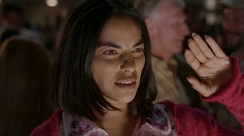 Movie still from “Lady in the Water” (2006), directed by M. Night Shyamalan – A person wearing a pink shirt; Close Up shot, Over the shoulder angle