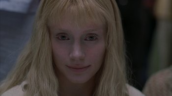 Movie still from “Lady in the Water” (2006), directed by M. Night Shyamalan – A person with blonde hair; Close Up shot, Overhead angle