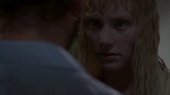 Movie still from “Lady in the Water” (2006), directed by M. Night Shyamalan – A person looking into a mirror; Close Up shot, Over the shoulder angle