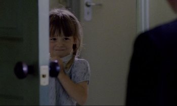 Movie still from “Ladybird Ladybird” (1994), directed by Ken Loach – A little girl standing in front of a bathroom mirror; Close Up shot, Over the shoulder angle