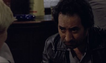 Movie still from “Ladybird Ladybird” (1994), directed by Ken Loach – A person sitting in a room; Close Up shot, Over the shoulder angle