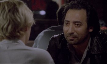 Movie still from “Ladybird Ladybird” (1994), directed by Ken Loach – A man sitting at a table talking to a woman; Close Up shot, Over the shoulder angle