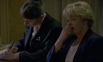 Movie still from “Ladybird Ladybird” (1994), directed by Ken Loach – Two women sitting next to each other in a room; Close Up shot, High angle