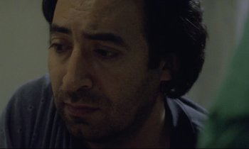 Movie still from “Ladybird Ladybird” (1994), directed by Ken Loach – A person looking at the camera; Close Up shot, Low angle