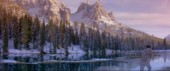 Movie still from “Ladyhawke” (1985), directed by Richard Donner – A mountain range with snow on the top of it; Extreme Wide shot, High angle