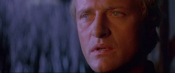 Movie still from “Ladyhawke” (1985), directed by Richard Donner – A man's face in a dark room; Close Up shot, Low angle