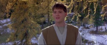 Movie still from “Ladyhawke” (1985), directed by Richard Donner – A young man wearing a brown vest and a white shirt; Close Up shot, Low angle