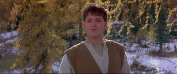 Movie still from “Ladyhawke” (1985), directed by Richard Donner – A young man wearing a brown and white robe; Close Up shot, Low angle