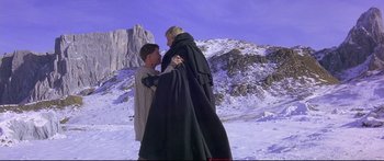 Movie still from “Ladyhawke” (1985), directed by Richard Donner – A man and a woman dressed in medieval garb in the snow; Wide shot, Low angle