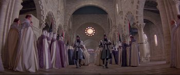Movie still from “Ladyhawke” (1985), directed by Richard Donner – A group of people dressed in medieval clothing; Extreme Wide shot, Low angle