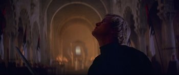 Movie still from “Ladyhawke” (1985), directed by Richard Donner – A man with his eyes wide open looking up at the ceiling; Close Up shot, Low angle