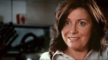 Movie still from “Lake Mungo” (2008), directed by Joel Anderson – A woman's face in a kitchen; Close Up shot, Low angle