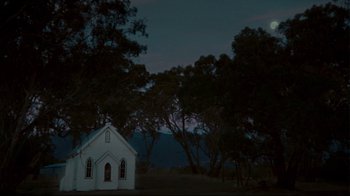 Movie still from “Lake Mungo” (2008), directed by Joel Anderson – A small white church in the middle of the night; Extreme Wide shot, Low angle