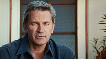 Movie still from “Lake Mungo” (2008), directed by Joel Anderson – A person wearing a blue shirt; Close Up shot, Low angle
