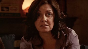 Movie still from “Lake Mungo” (2008), directed by Joel Anderson – A person with long brown hair; Close Up shot, Over the shoulder angle