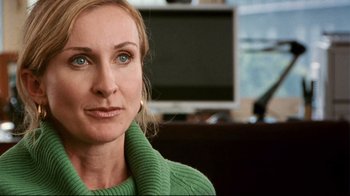 Movie still from “Lake Mungo” (2008), directed by Joel Anderson – A person wearing a green sweater; Close Up shot, Over the shoulder angle