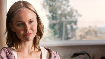 Movie still from “Lake Mungo” (2008), directed by Joel Anderson – A person wearing a pink shirt; Close Up shot, Over the shoulder angle