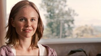 Movie still from “Lake Mungo” (2008), directed by Joel Anderson – A person with long brown hair; Close Up shot, Over the shoulder angle