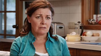 Movie still from “Lake Mungo” (2008), directed by Joel Anderson – A person in a kitchen; Close Up shot, Over the shoulder angle