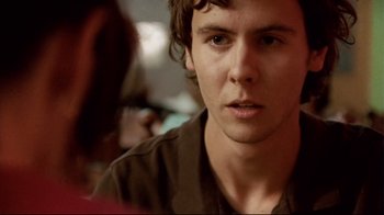 Movie still from “Lake Mungo” (2008), directed by Joel Anderson – A young man is sitting in front of another man; Close Up shot, Over the shoulder angle
