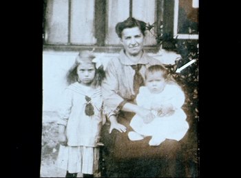 Movie still from “Land of Silence and Darkness” (1971), directed by Werner Herzog – An old photo of a woman and two children; Extreme Close Up shot, High angle