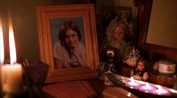 Movie still from “Lantana” (2001), directed by Ray Lawrence – A picture of a young girl in front of an old doll; Close Up shot, High angle