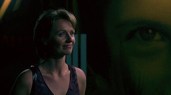 Movie still from “Lantana” (2001), directed by Ray Lawrence – A woman in a purple top looking up at the sky; Close Up shot, Low angle