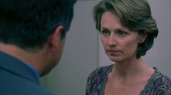 Movie still from “Lantana” (2001), directed by Ray Lawrence – A man and a woman looking at each other in a mirror; Close Up shot, Over the shoulder angle