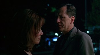 Movie still from “Lantana” (2001), directed by Ray Lawrence – A man and a woman standing next to each other in the dark; Close Up shot, Over the shoulder angle