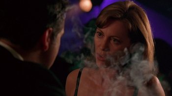 Movie still from “Lantana” (2001), directed by Ray Lawrence – A man and a woman are smoking in a dark room; Close Up shot, Over the shoulder angle