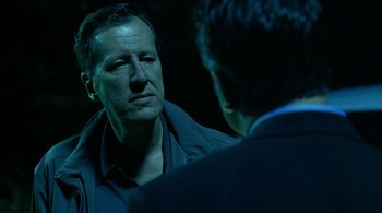 Movie still from “Lantana” (2001), directed by Ray Lawrence – A man in a blue jacket talking to another man; Close Up shot, Over the shoulder angle