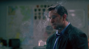 Movie still from “Lantana” (2001), directed by Ray Lawrence – A person wearing a suit and tie; Close Up shot, Low angle