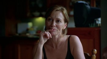 Movie still from “Lantana” (2001), directed by Ray Lawrence – A person sitting at a table; Close Up shot, Over the shoulder angle