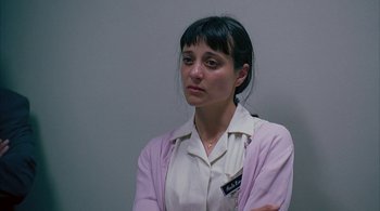 Movie still from “Lantana” (2001), directed by Ray Lawrence – A woman in a white shirt and a pink jacket; Close Up shot, High angle