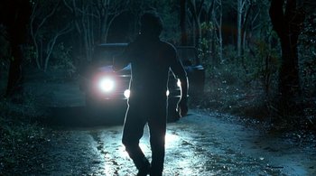 Movie still from “Lantana” (2001), directed by Ray Lawrence – A man walking on the street in the dark; Wide shot, Low angle