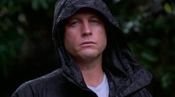 Movie still from “Lantana” (2001), directed by Ray Lawrence – A person wearing a black jacket; Close Up shot, Low angle