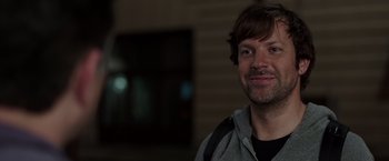 Movie still from “We're the Millers” (2013), directed by Rawson Marshall Thurber – A person smiling for the camera; Close Up shot, Over the shoulder angle