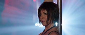 Movie still from “We're the Millers” (2013), directed by Rawson Marshall Thurber – A beautiful woman with short black hair posing for a picture; Close Up shot, Over the shoulder angle