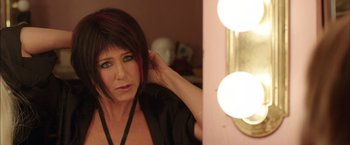Movie still from “We're the Millers” (2013), directed by Rawson Marshall Thurber – A woman with red hair is looking in a mirror; Close Up shot, Over the shoulder angle