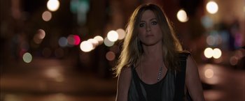 Movie still from “We're the Millers” (2013), directed by Rawson Marshall Thurber – A beautiful woman standing on a street at night; Close Up shot, High angle