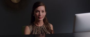Movie still from “We're the Millers” (2013), directed by Rawson Marshall Thurber – A beautiful young lady sitting at a table; Close Up shot, Over the shoulder angle