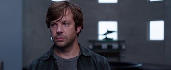 Movie still from “We're the Millers” (2013), directed by Rawson Marshall Thurber – A person wearing a plaid shirt; Close Up shot, Over the shoulder angle