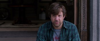 Movie still from “We're the Millers” (2013), directed by Rawson Marshall Thurber – A person wearing a plaid shirt; Close Up shot, Over the shoulder angle