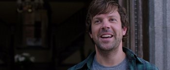 Movie still from “We're the Millers” (2013), directed by Rawson Marshall Thurber – A person with a beard smiling; Close Up shot, Over the shoulder angle