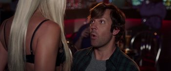 Movie still from “We're the Millers” (2013), directed by Rawson Marshall Thurber – A young man looking at a woman in a bar; Close Up shot, Over the shoulder angle