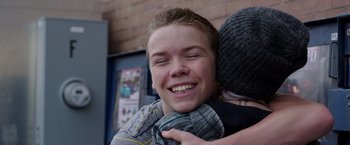 Movie still from “We're the Millers” (2013), directed by Rawson Marshall Thurber – A young man is hugging another young man outside; Close Up shot, Over the shoulder angle